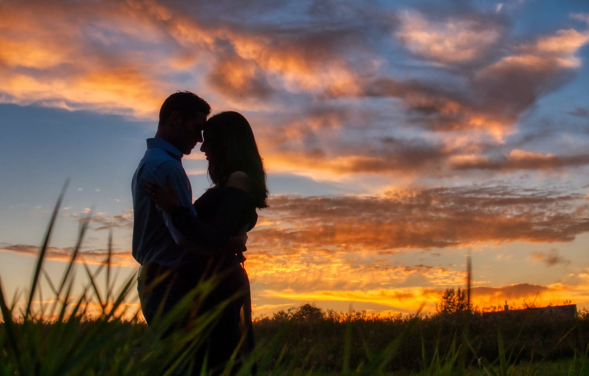 photo of couple hugging during dawn