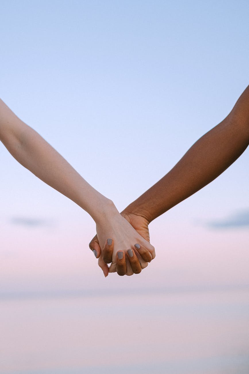 photo of people holding hands