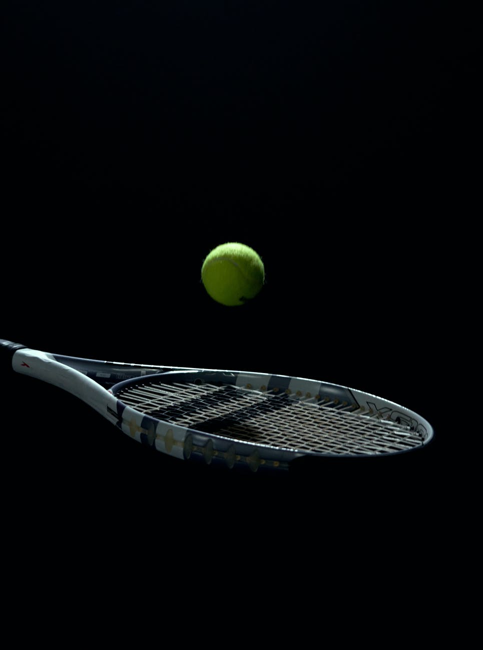 a tennis ball bouncing off a tennis racket
