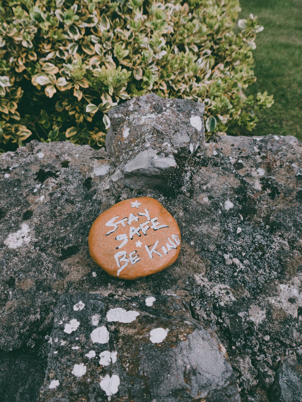 stay safe be kind inscription on stone