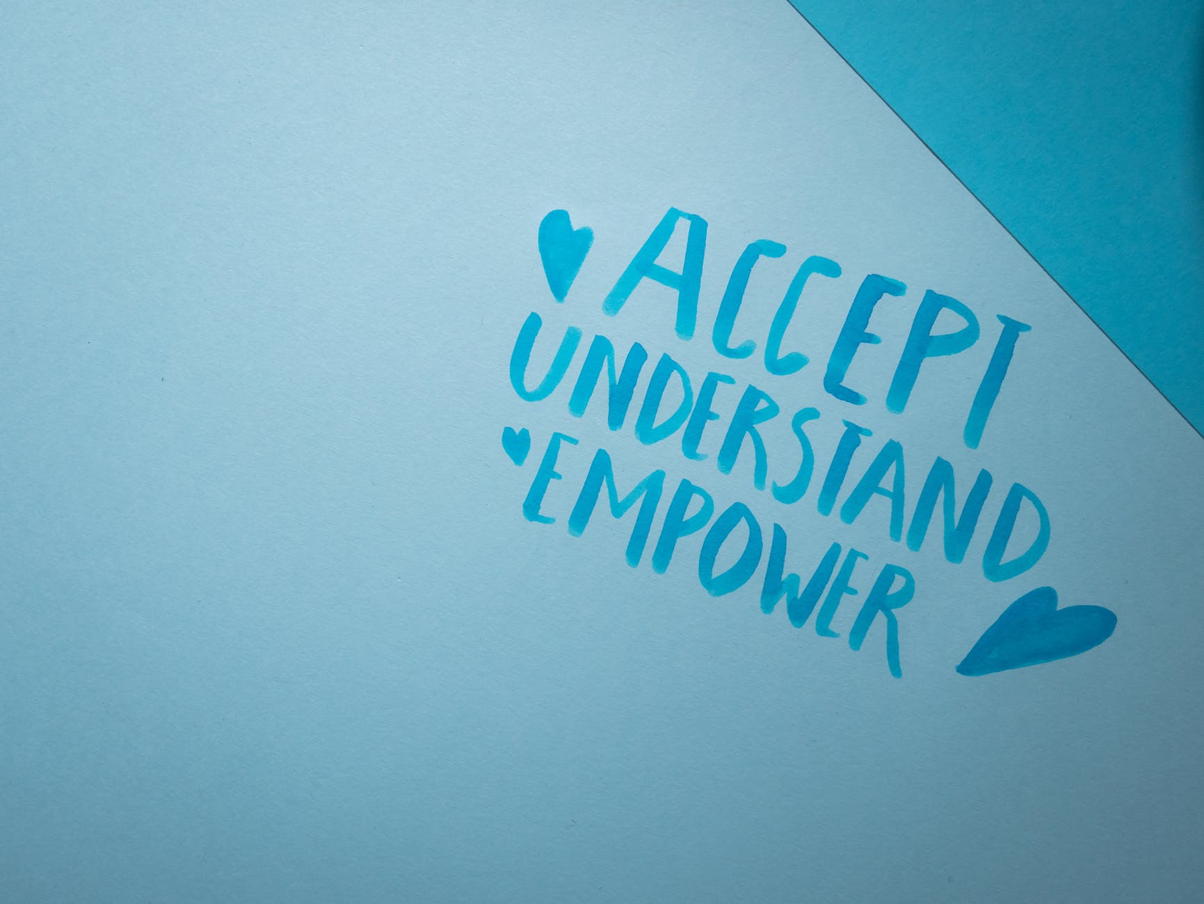 handwritten words on a blue surface