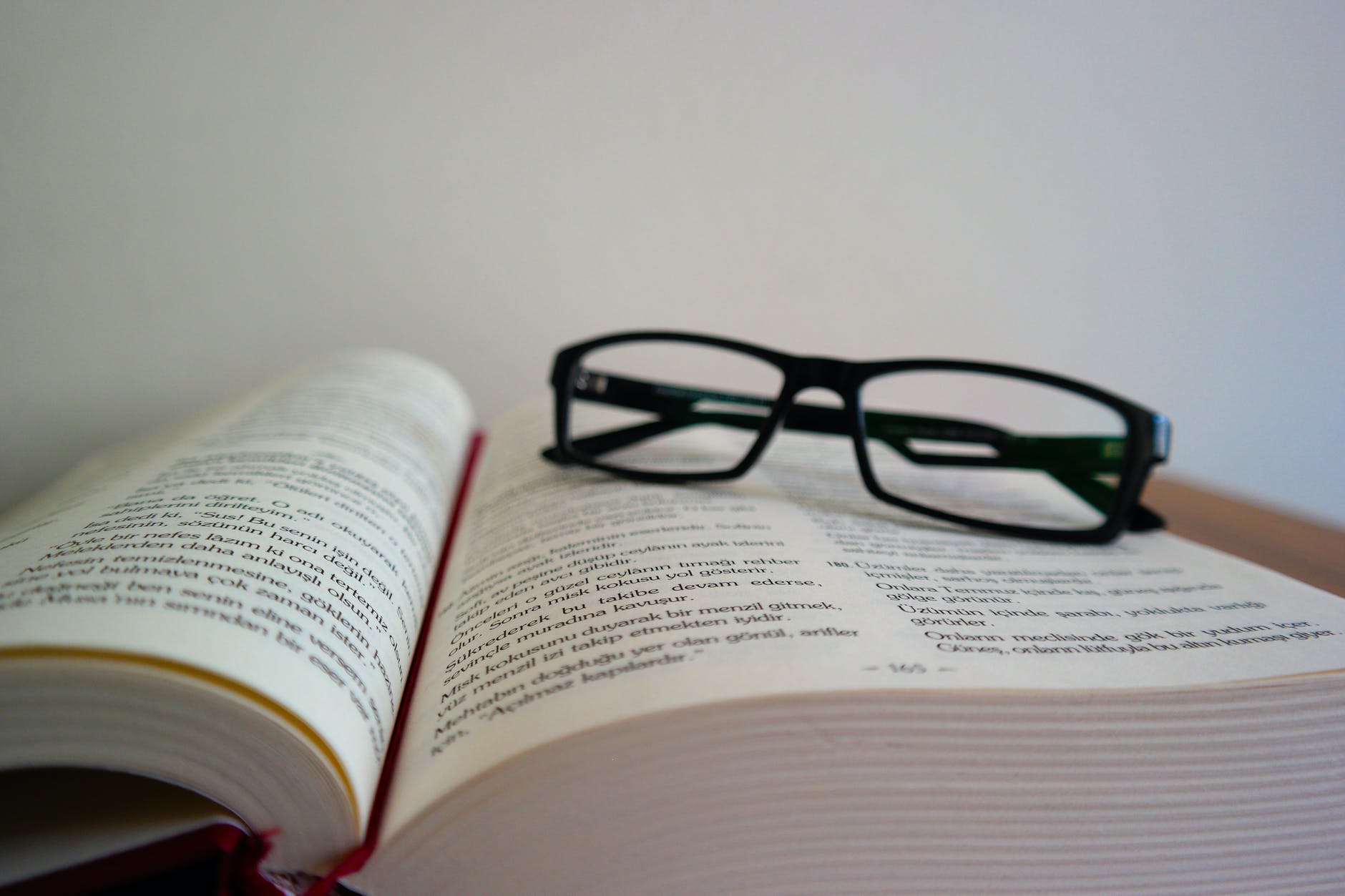 close up of eyeglasses on book